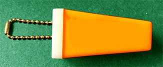 Vintage carnival photo telescope keychain viewer showing small handheld device with tiny film inside