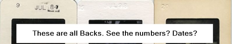 Backs of cardboard slide mounts showing dates and numbers