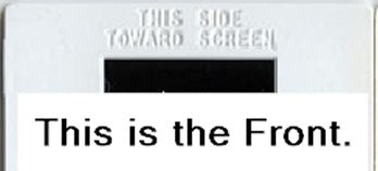 Plastic slide mount marked This Side Towards Screen