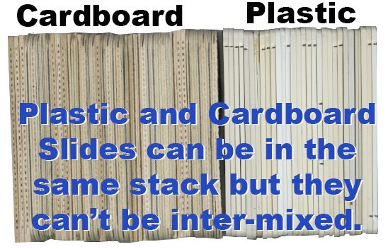 Cardboard and plastic slides arranged together in a single stack
